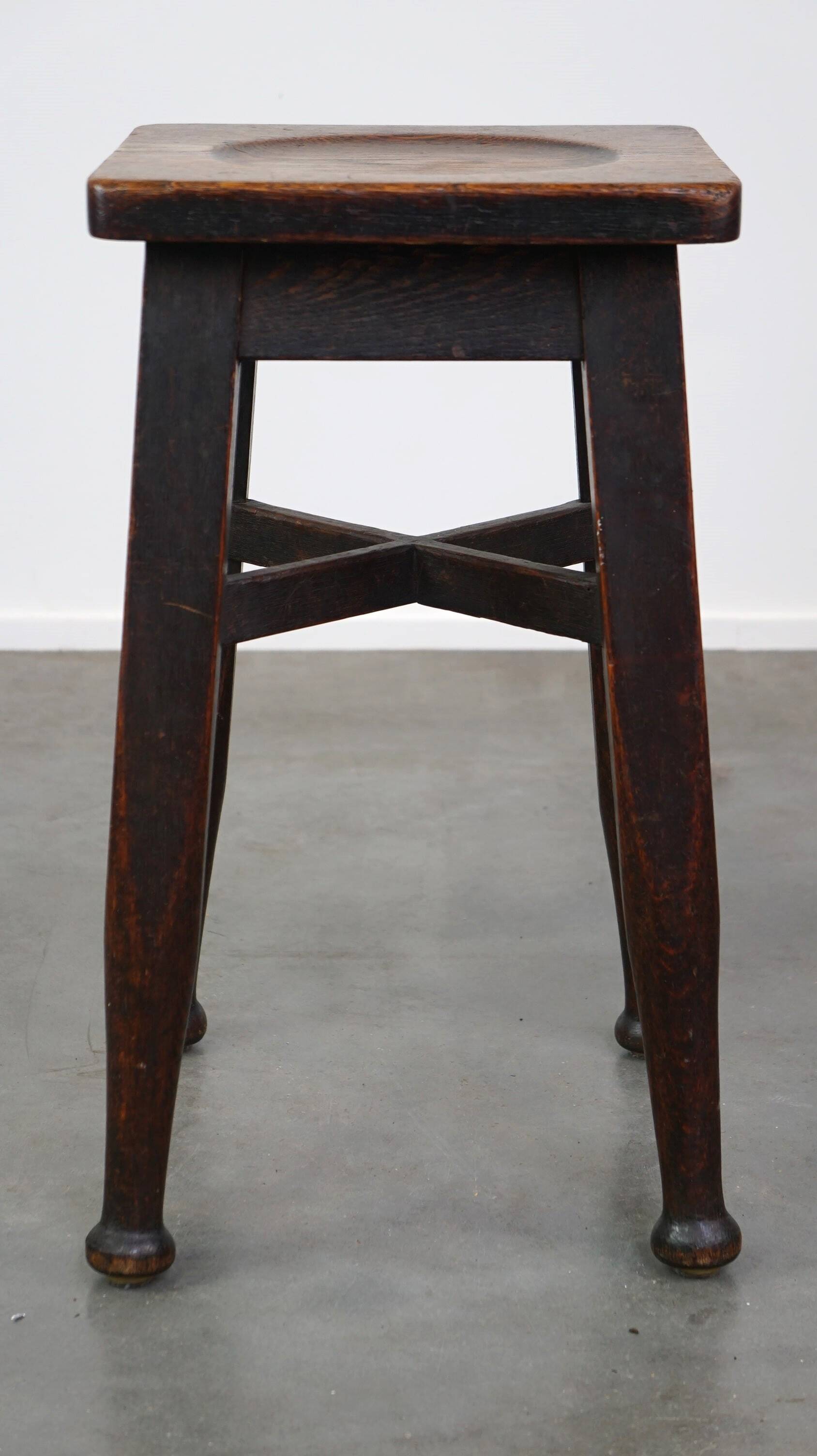 Antique English solid oak stool with a touch of art nouveau style