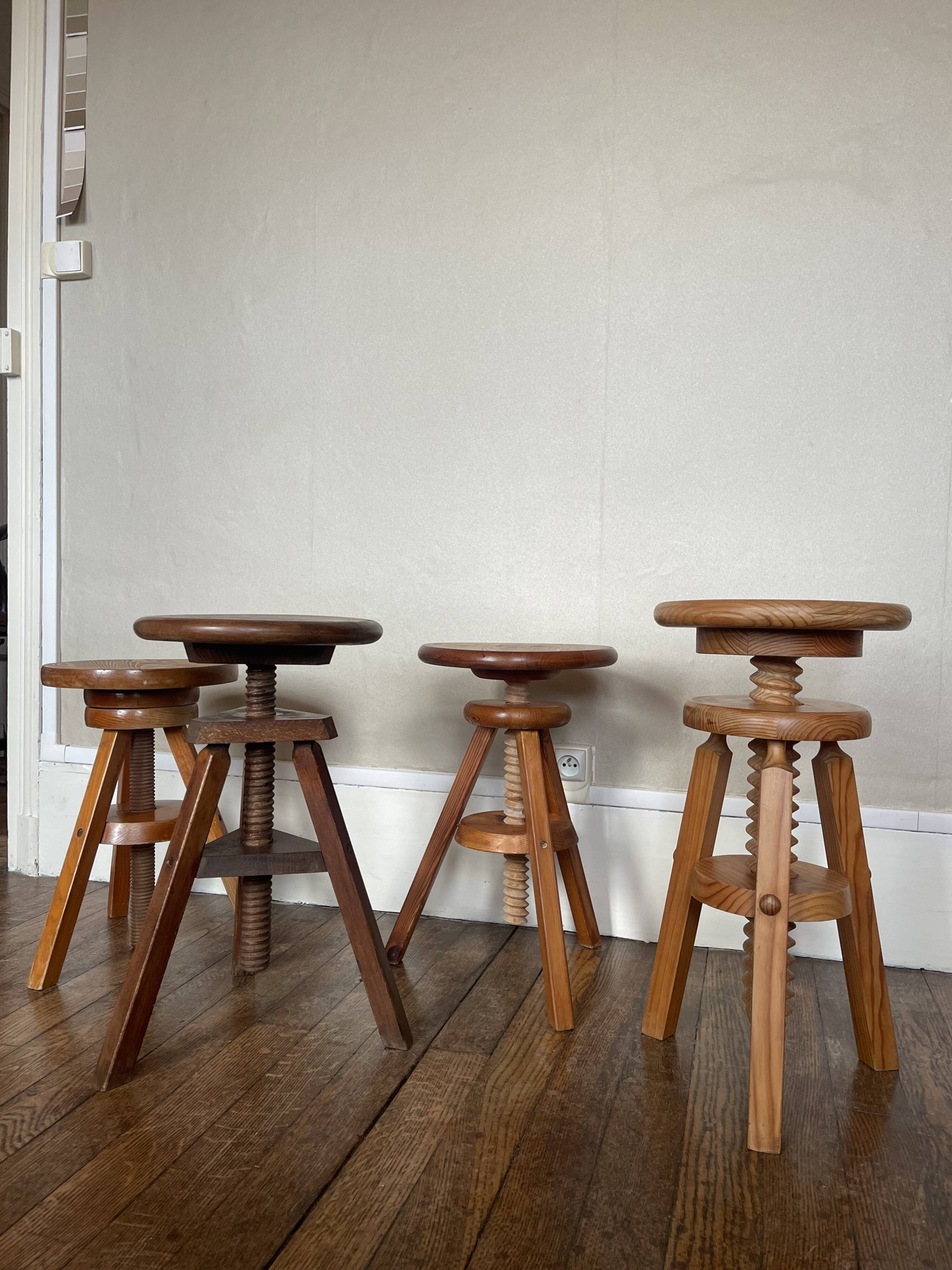 Set of 4 wooden screw stools.