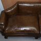 Restored Regency canapé in leather with sculpted Hermès frame.