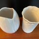 A pair of vintage ceramic vases from the 1970s.