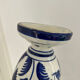 white amphora-style vase with hand-painted blue patterns