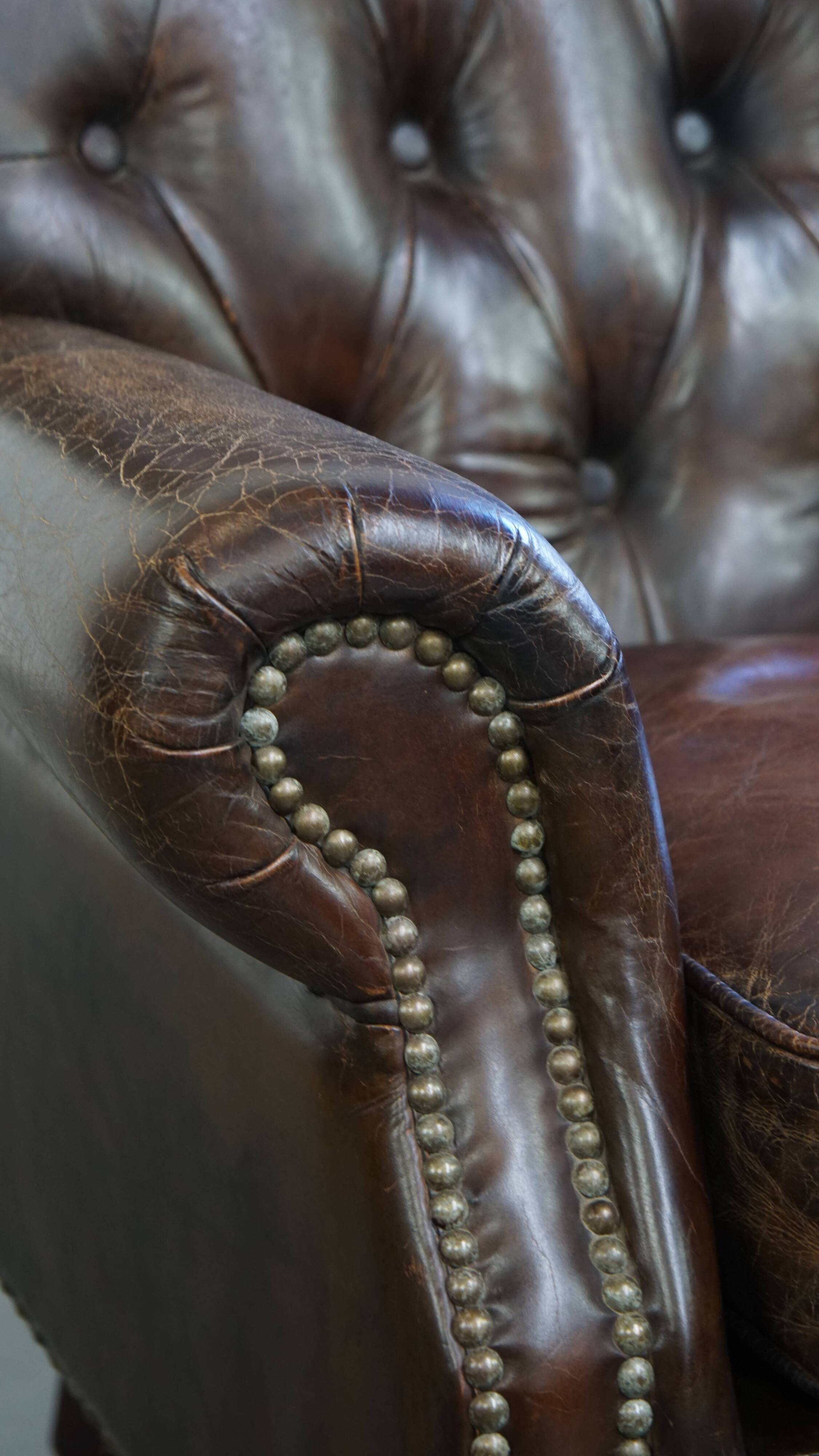 Cognac colored brown grained cowhide chesterfield armchair