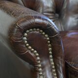 Cognac colored brown grained cowhide chesterfield armchair