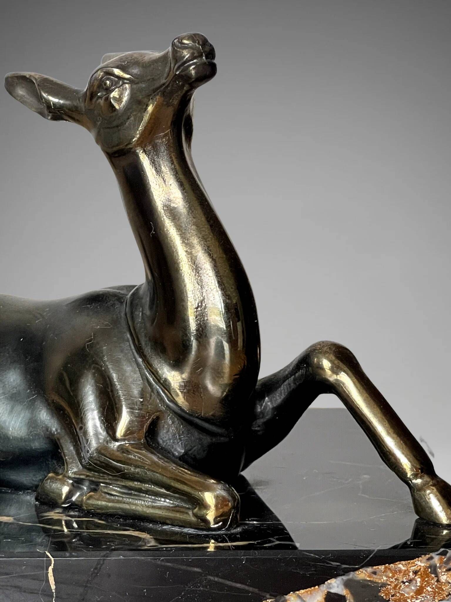 Pair of deer bookends in black marble and gold metal – Art Deco style