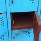 Old blue metal locker with wooden top