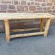 Primitive industrial table workbench in raw natural wood vintage bohemian trade store