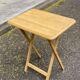 Small Scandinavian folding side table in solid wood.