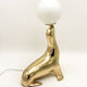 Vintage brass sea lion lamp