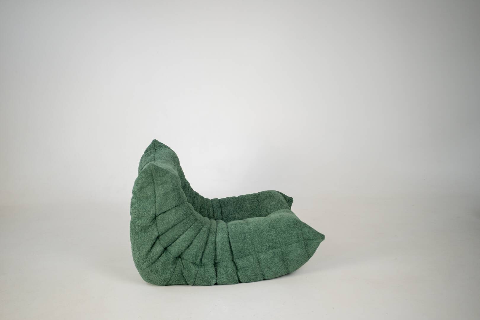 Togo set of armchair and pouf in emerald bucle