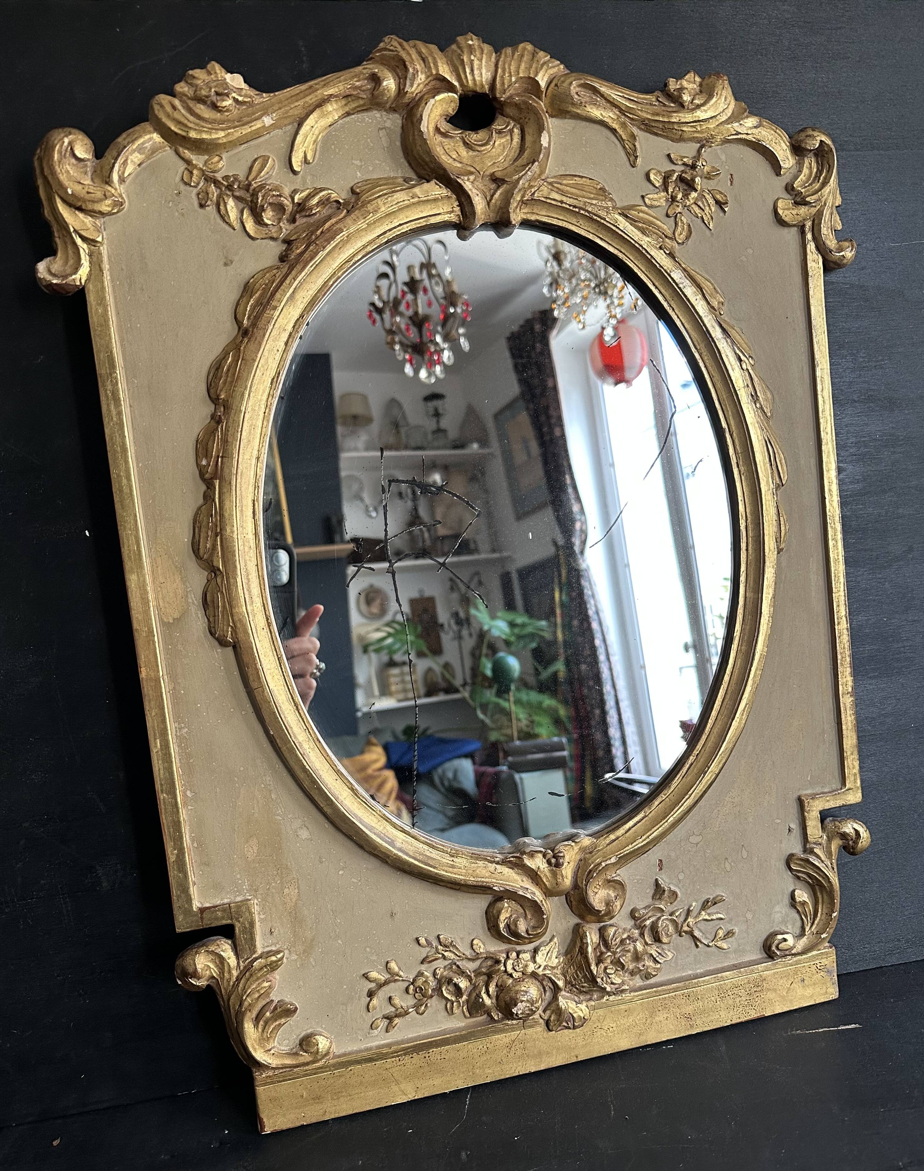 Napoleon III mirror in carved gilded wood, oval mercury glass.