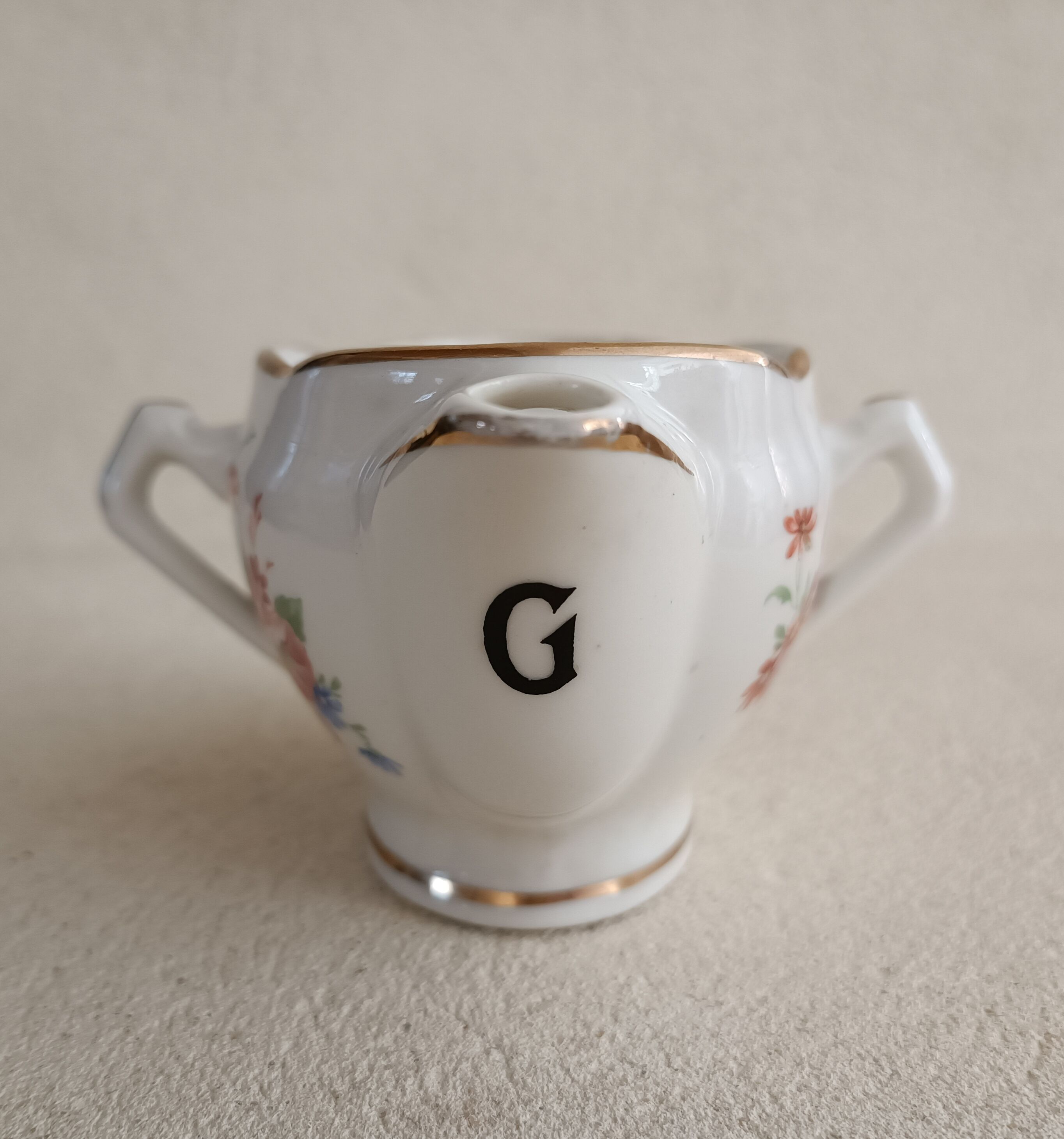 Lean fat sausage in Limoges porcelain