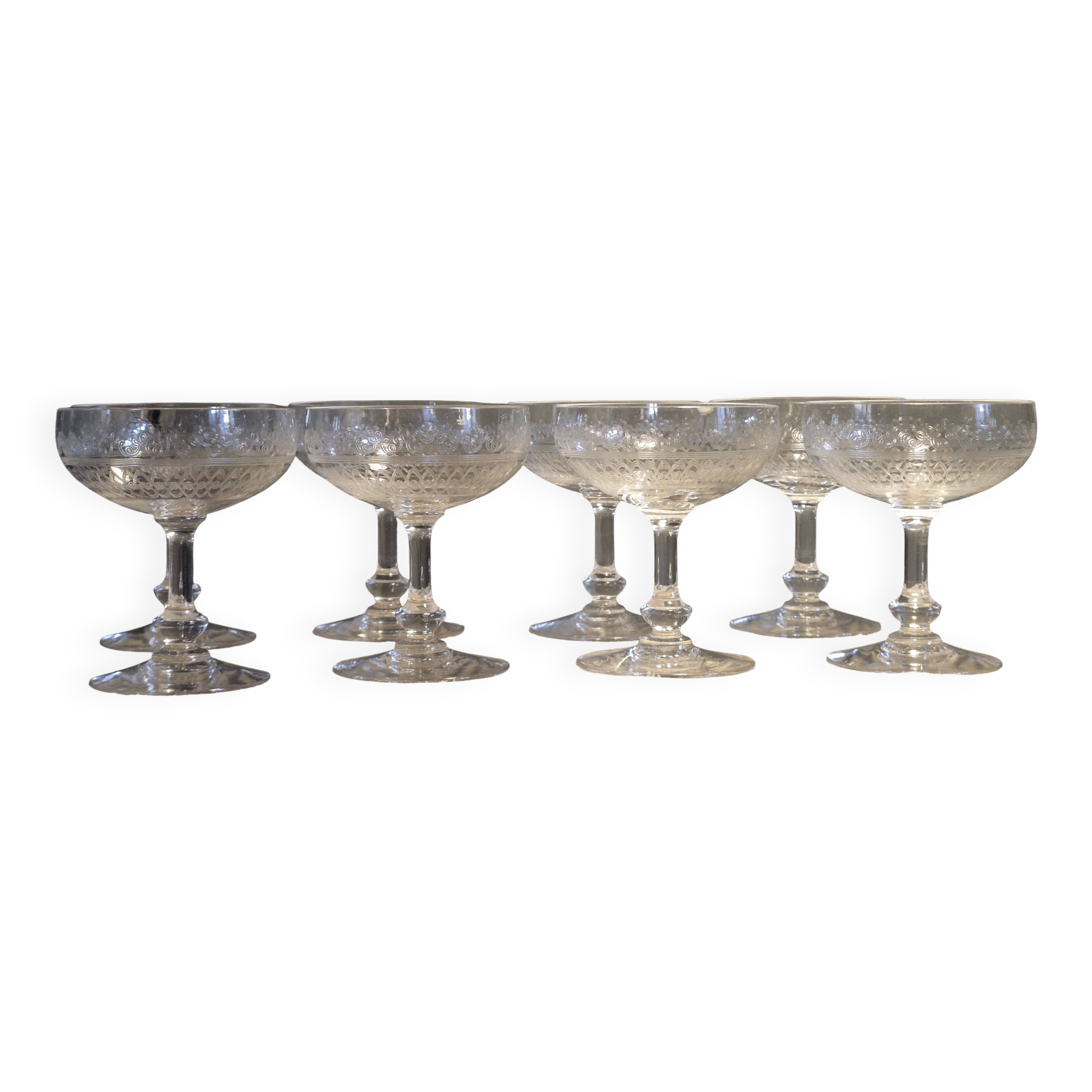 8 antique Baccarat crystal champagne coupes with engraved decoration.