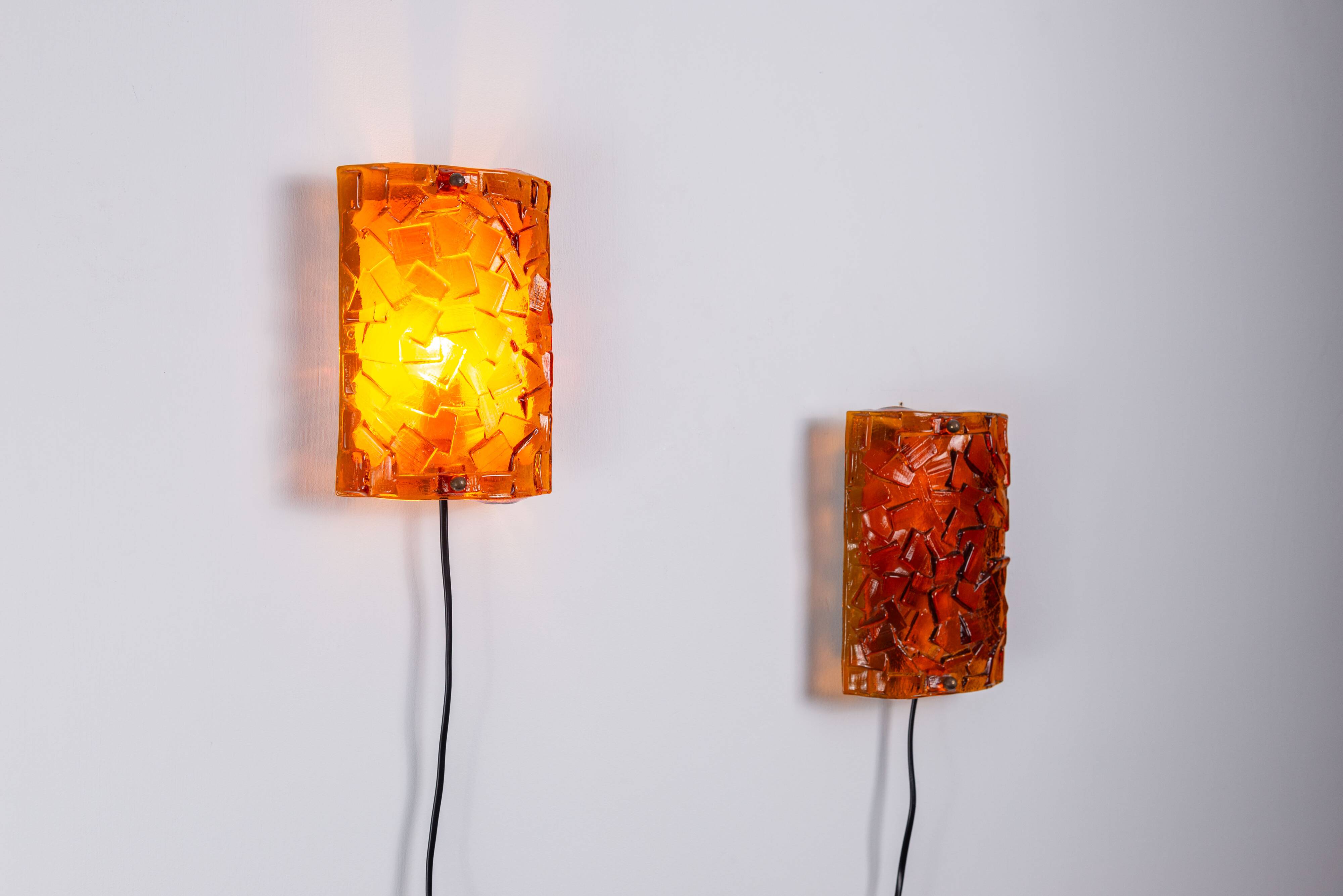 Vitrika Nybro amber coloured wall lamps