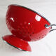 Colander on foot in red enamelled metal