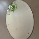 Old bevelled stitched oval mirror