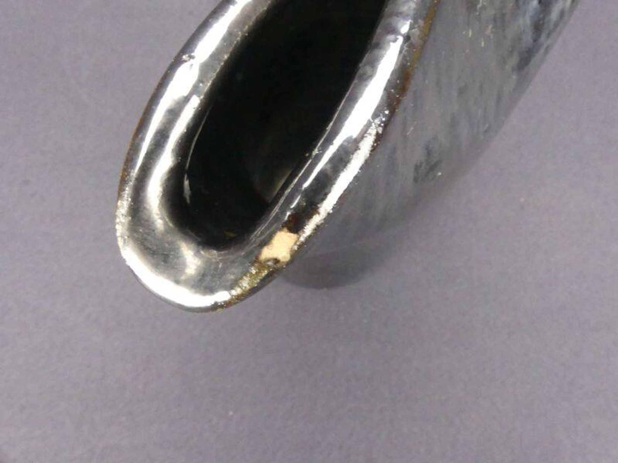 Old Biot, modernist pitcher in iridescent black ceramic.