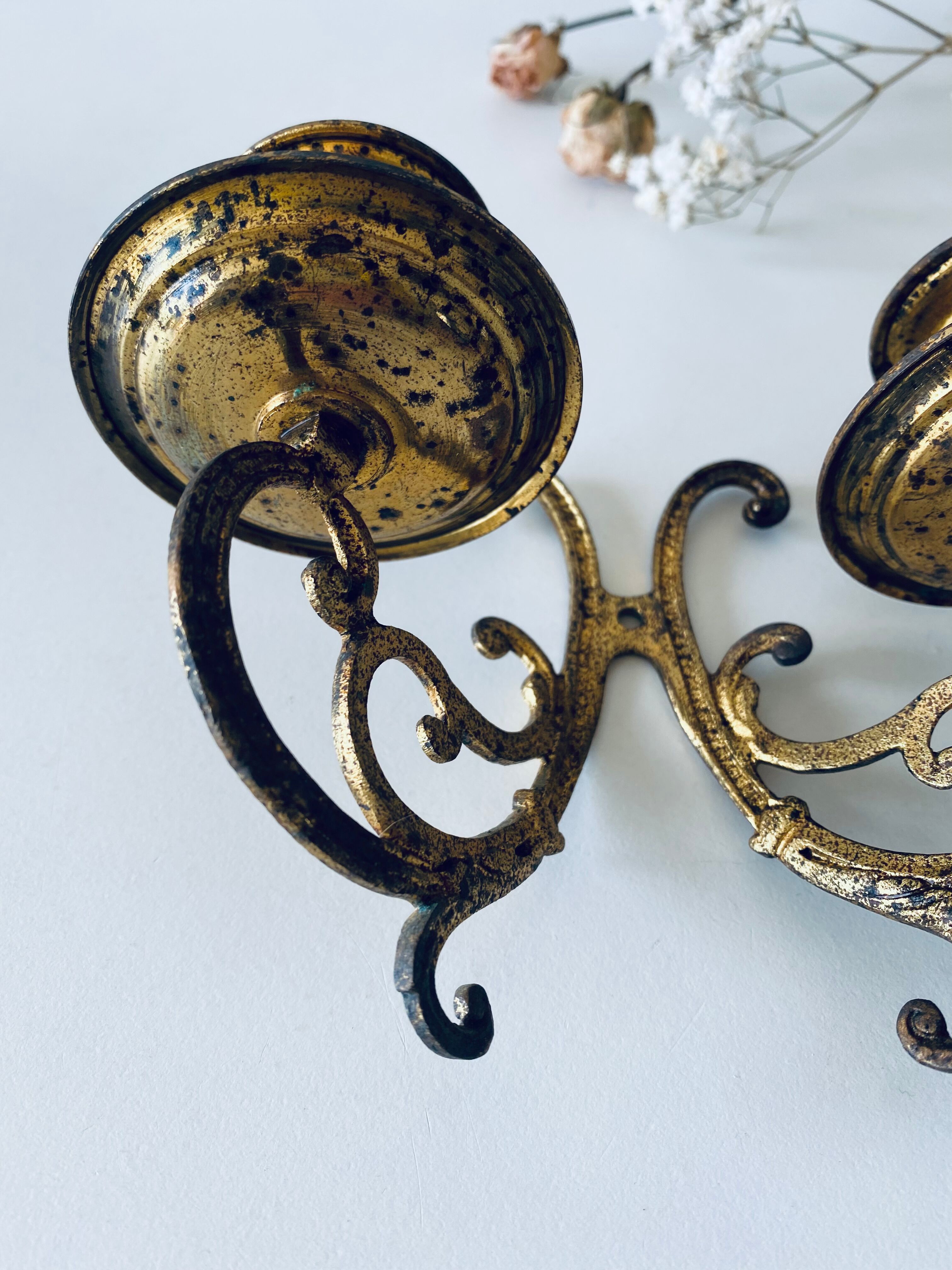 Old wall candle holder in golden brass