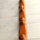 Wall-mounted coat rack in wood and brass