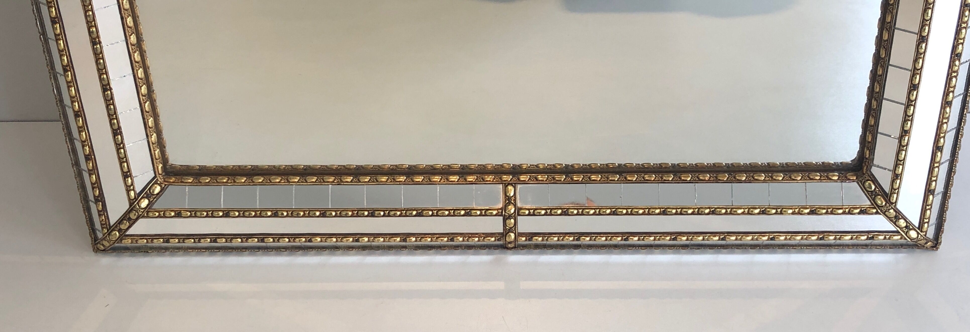 Mirror consisting of multi-faceted mirrors and brass garlands, French work, around 1970