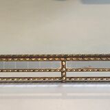 Mirror consisting of multi-faceted mirrors and brass garlands, French work, around 1970