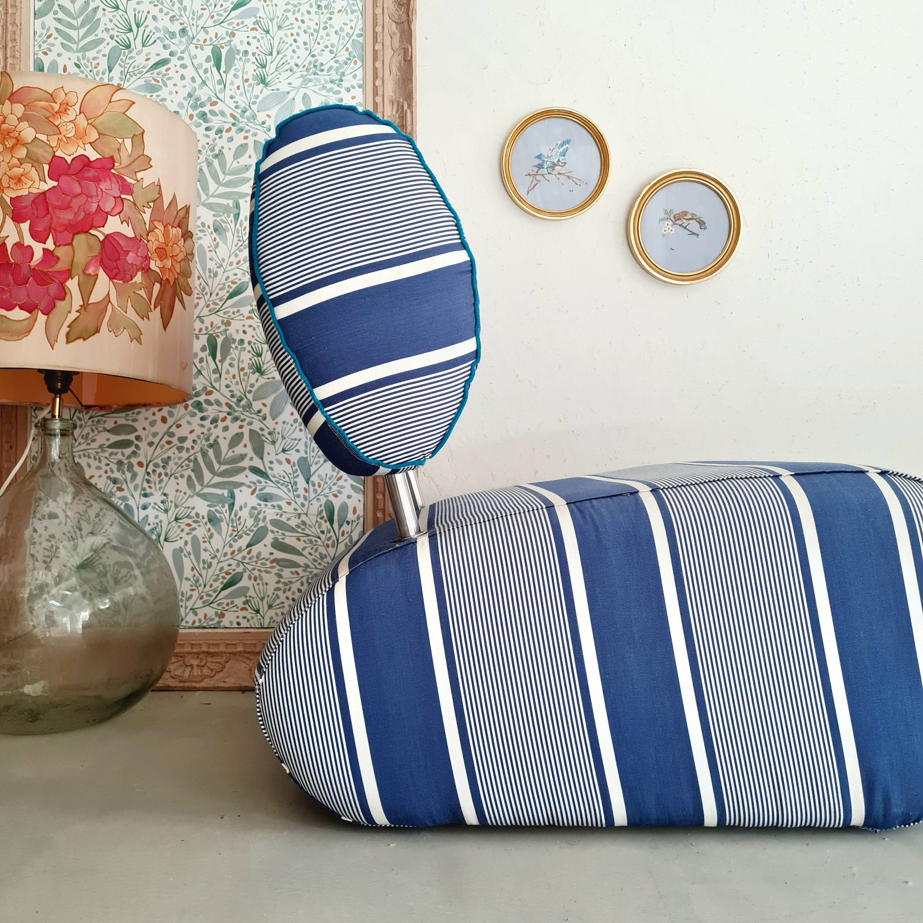 Curved armchair with blue and white stripes
