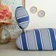 Curved armchair with blue and white stripes