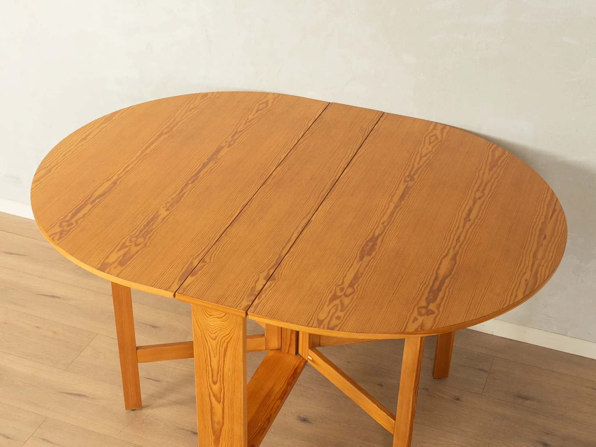 Practical folding table from the 1980s made of light brown pine wood