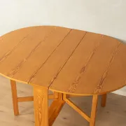 Practical folding table from the 1980s made of light brown pine wood