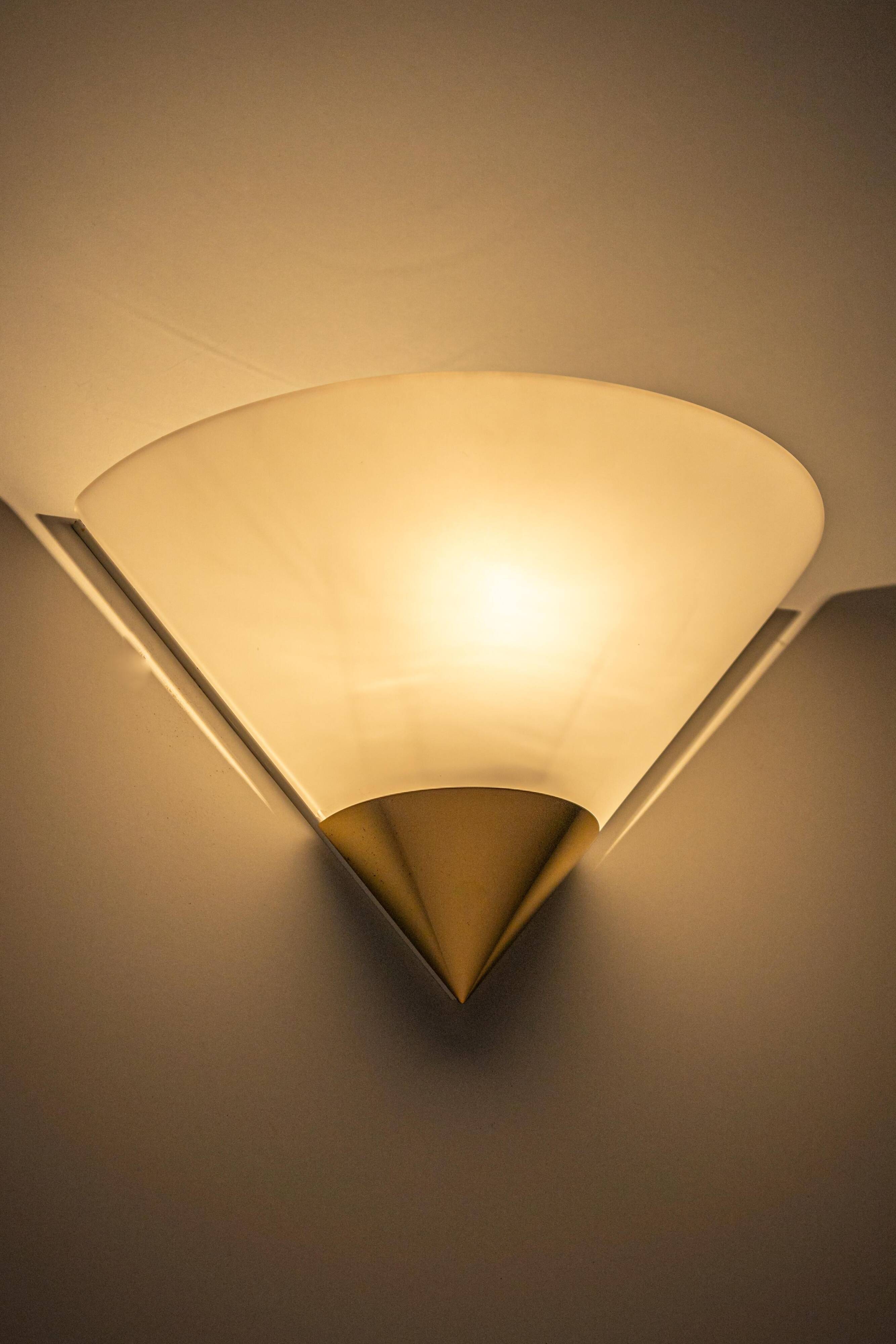 Pair of opal glass wall lights designed by Limburg, Germany.