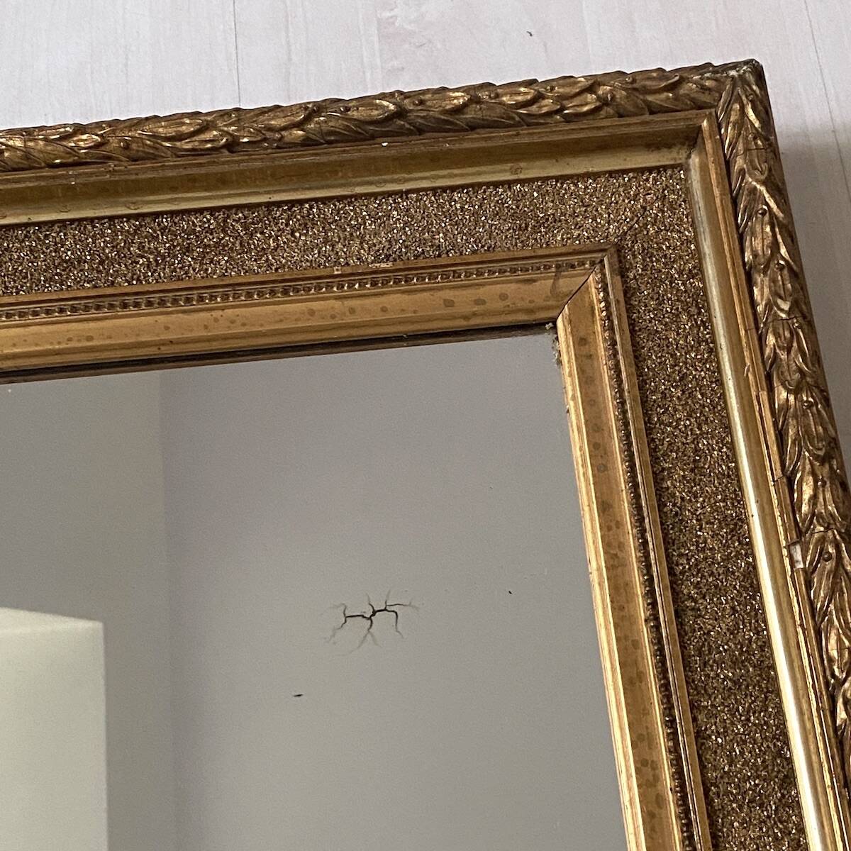 Small wooden mirror with gilded stucco in the Louis XVI style.
