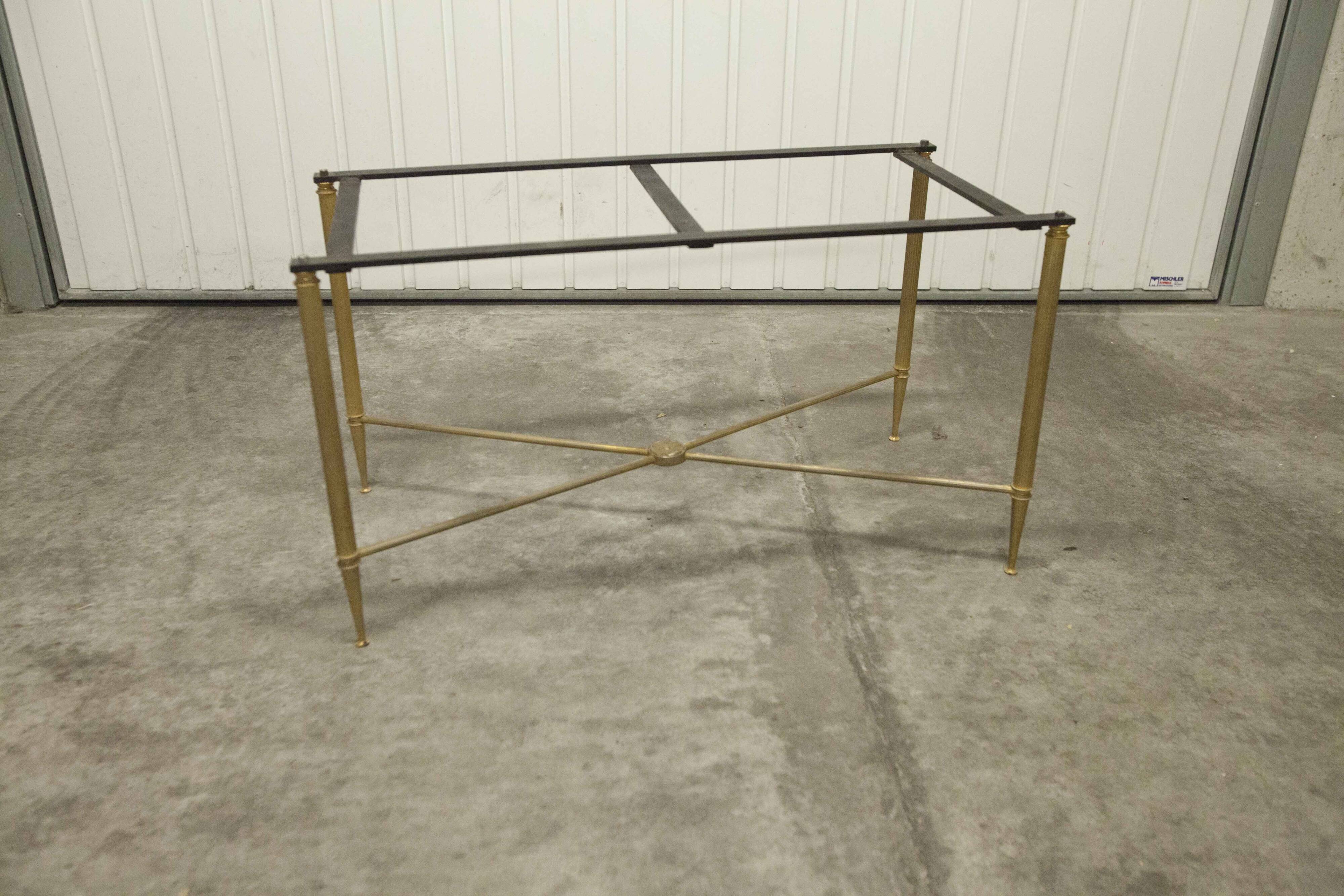 Marble coffee table with brass legs, height 46 cm.