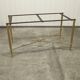 Marble coffee table with brass legs, height 46 cm.