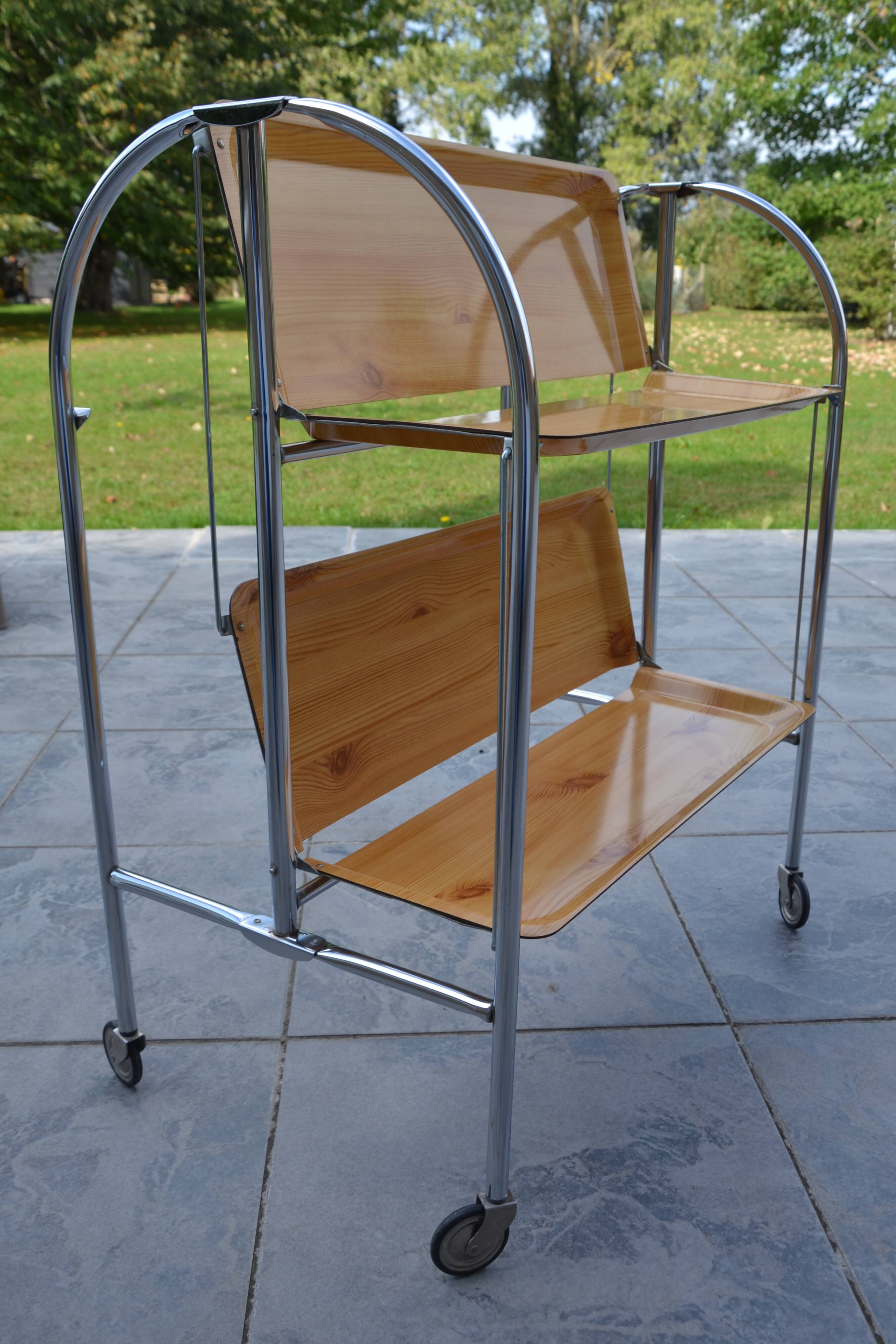 Folding dessert trolley on chrome metal wheels and formica.