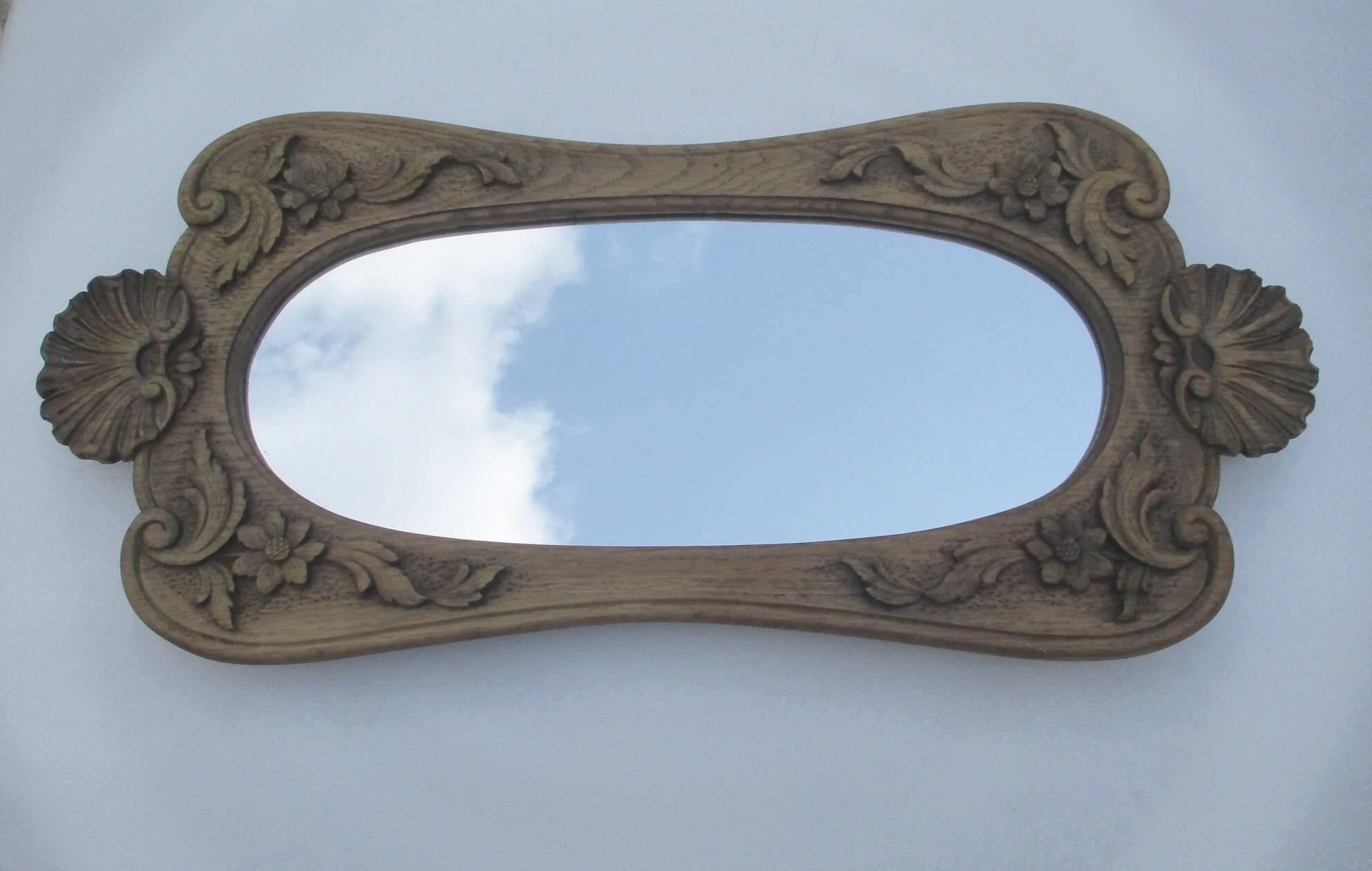 Antique carved wooden mirror