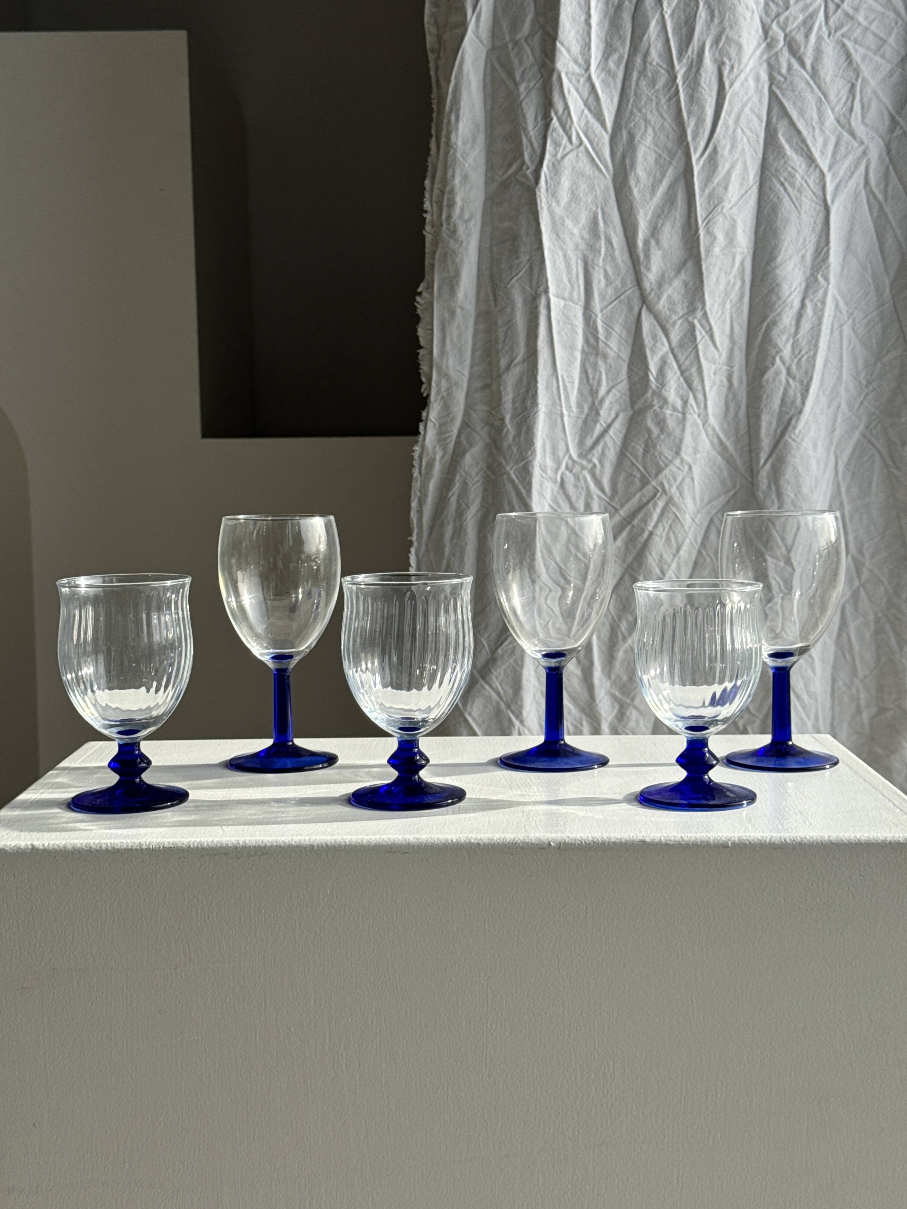 Set of 3 large blue stemmed glasses and 3 small blue stemmed glasses