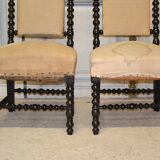 Pair of low armchairs in blackened wood