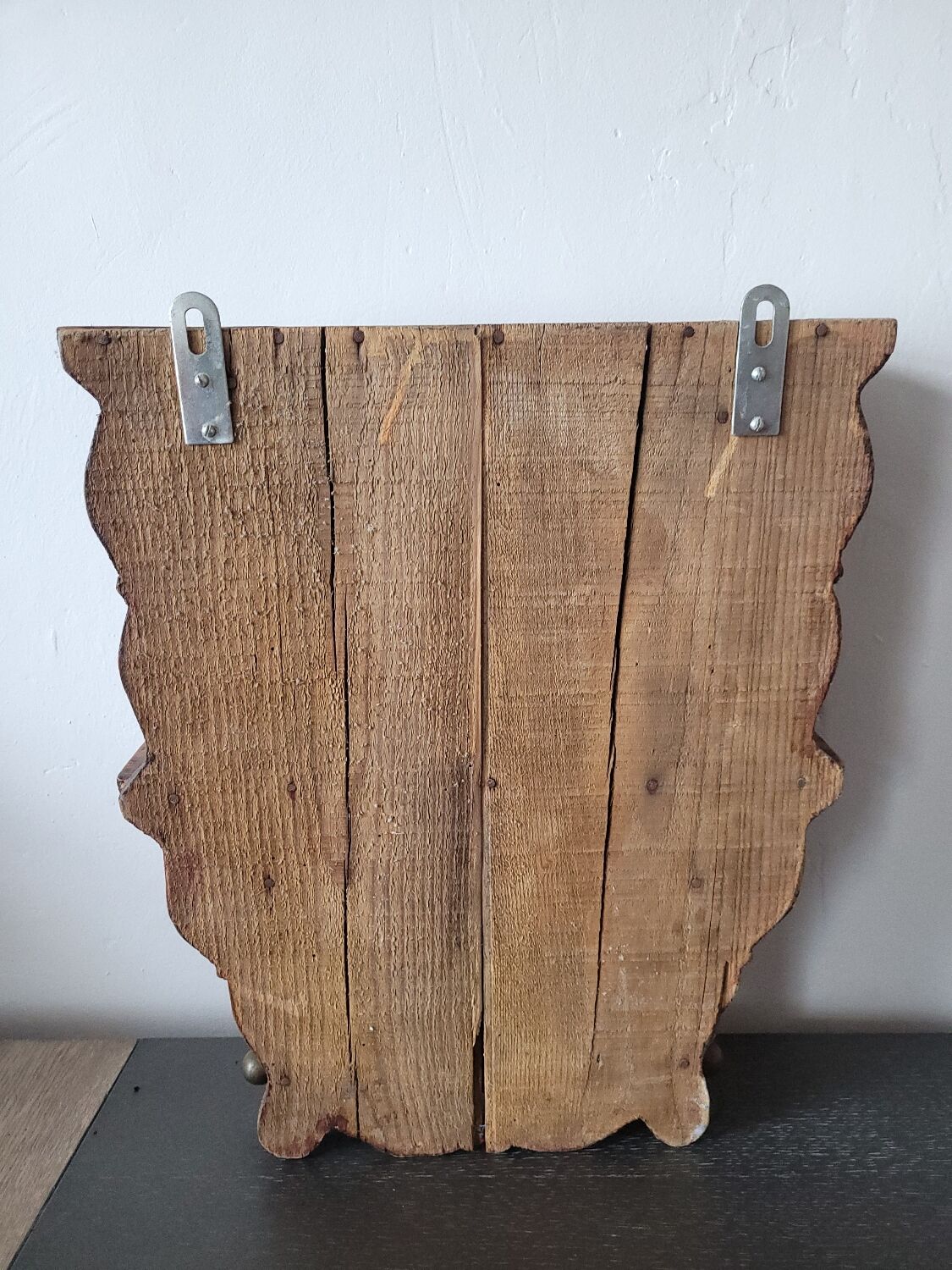 Small antique wall shelf with a drawer in light solid wood.