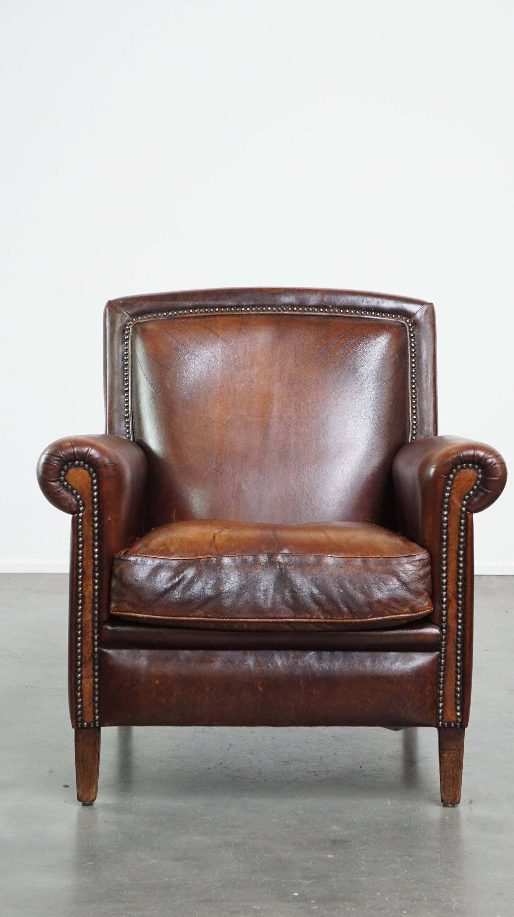 Vintage sheepskin armchair with beautiful warm colors and excellent seating comfort