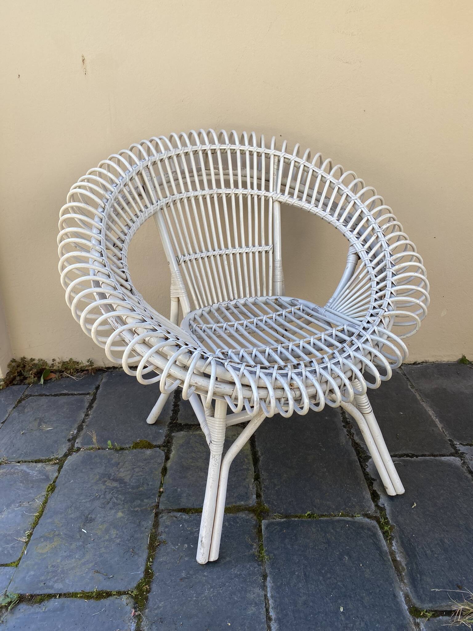 Vintage white rattan armchair