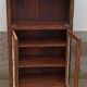 Petite armoire vitrée en bois avec porte rentrante