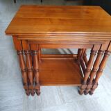 Nesting tables in solid cherry wood held together by slides
