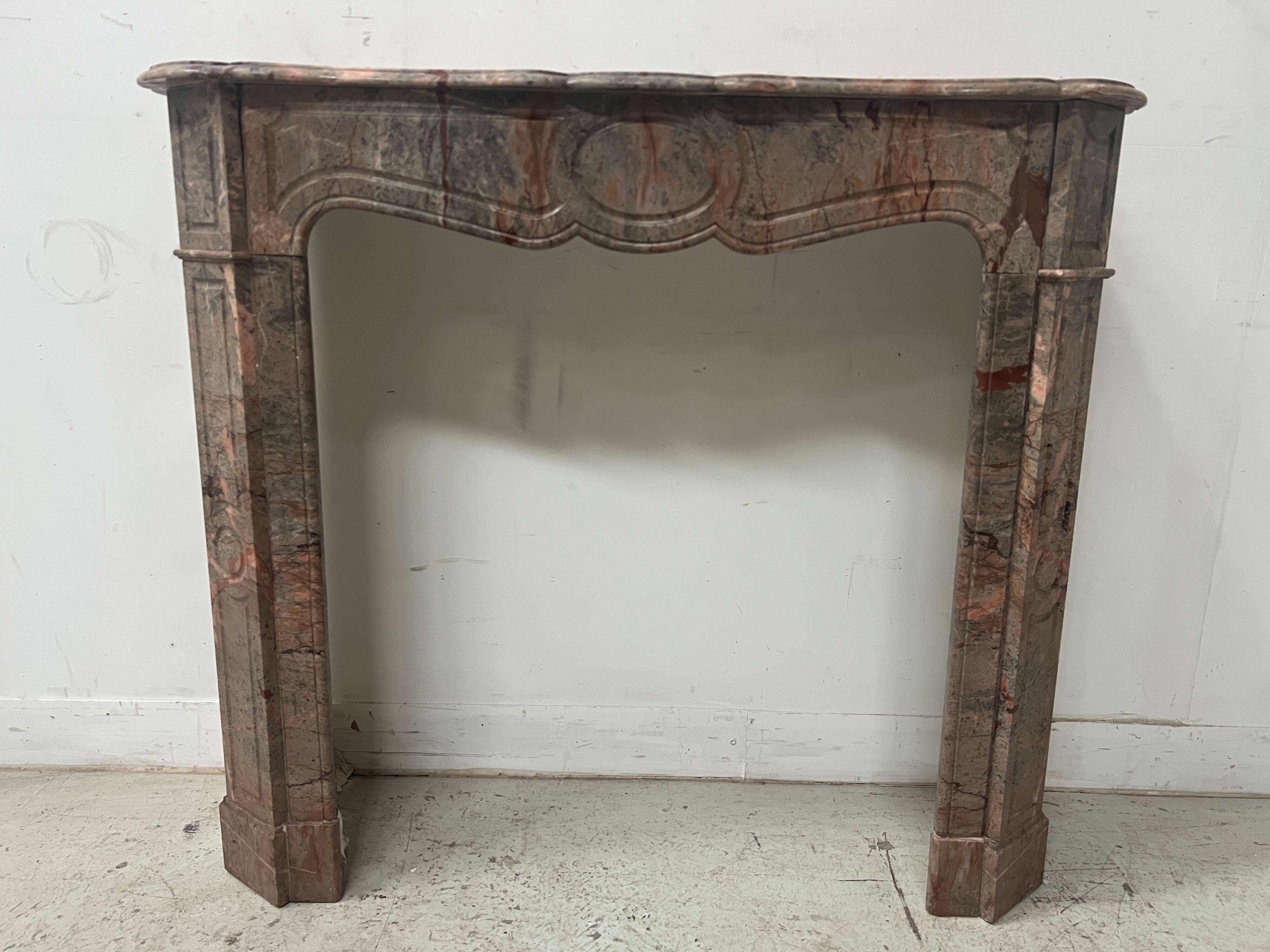 Louis XV style fireplace, "Pompadour" model, grey-pink marble, 20th century