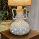 1970s lamp in white ceramic with its period shade.