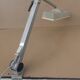 WALDMANN articulated workshop lamp with two industrial clamp arms for architects.