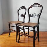 Pair of chairs from the early 20th century, Napoleon III style, with caned seats.