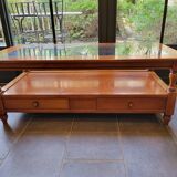 Coffee table with 2 drawers in solid cherry wood and glass.