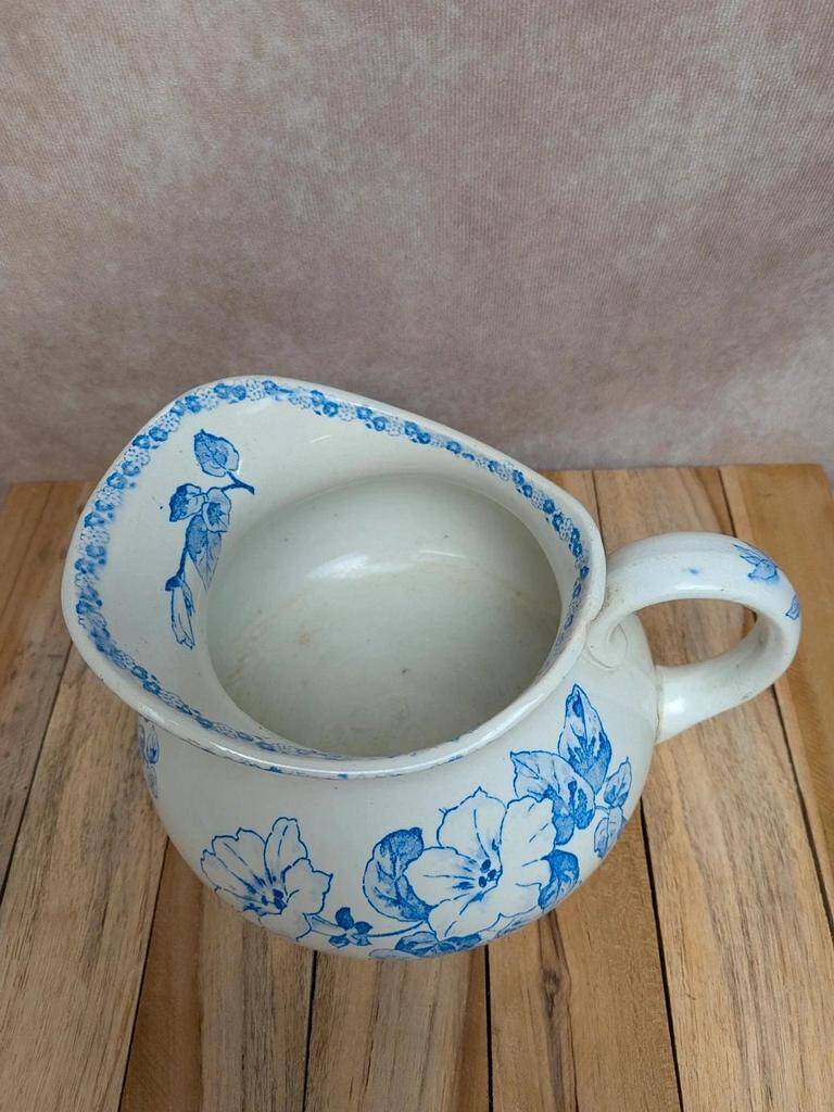 Small antique ironstone jug L.m Creil and Montereau with blue floral decoration.