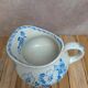 Small antique ironstone jug L.m Creil and Montereau with blue floral decoration.