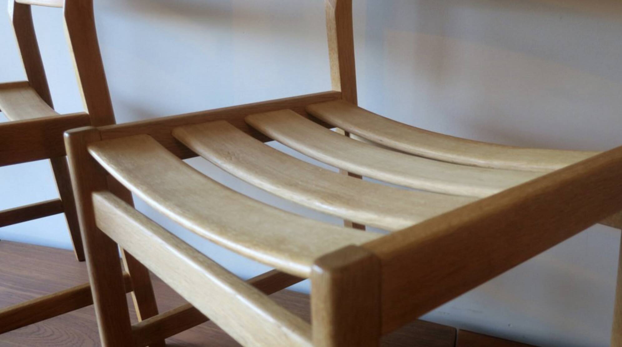 Pair of solid ash wide-seat dining chairs by Kurt Ostervig for KP Mobler, Denmark 1950s