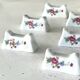 Ensemble de 12 repose-couteaux en porcelaine française avec motifs floraux